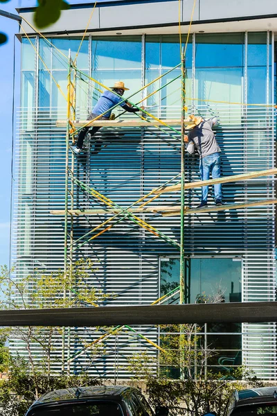 in times of pandemic workers cover their faces as a precaution against the virus