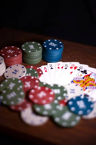 Poker set.  Set for the game.  Game set.  Board game.  Playing on a brown background 