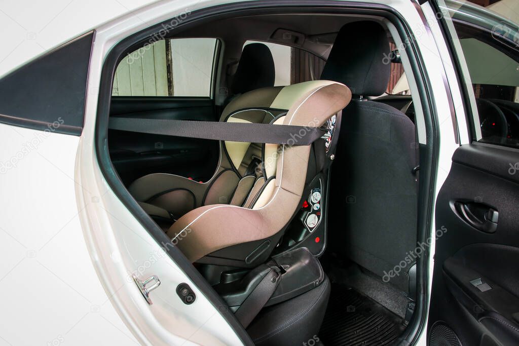 Child safety car seat installation inside rear seat.