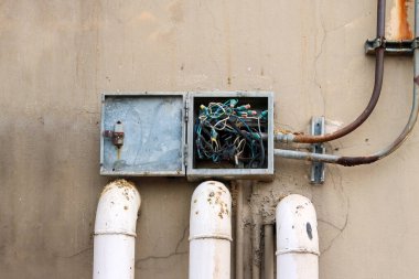Tangled wire in electric box and dirty from bird droppings
