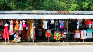 Phetchaburi, Thailand - December 30, 2018 : Clothing and swimwear store is colorful beside the road at Cha-am beach