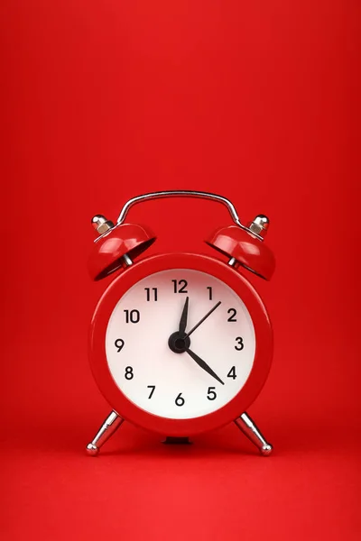 Close One Small Red Metal Twin Bell Retro Alarm Clock Stock Image