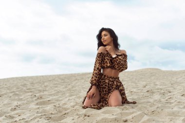 Girl in the dunes on a cloudy day