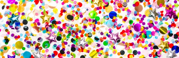 Colorful confetti border line on white background. creative glitter decoration. holiday flat lay header — Stock Photo, Image