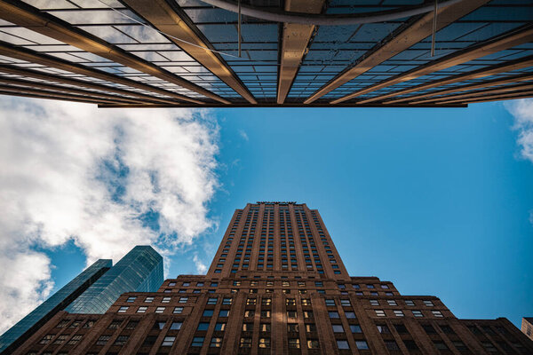 Looking directly up at the skyline of the financial district in Manhattan NYC. High-quality photo