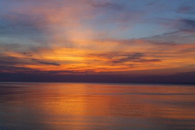 Panoramic view of seascape sunset with lingering rays of the sun at the Atlantic Ocean in Woodland State Park, Long Island the USA. High-quality photo