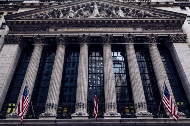 Front of the 1908 New York Stock Exchange on Broad Street with American flags on a front. High quality photo
