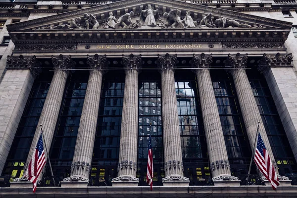 Front of the 1908 New York Stock Exchange on Broad Street with American flags on a front. High quality photo