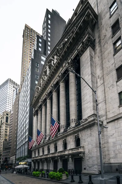 Front of the 1908 New York Stock Exchange on Broad Street with American flags on a front. High quality photo