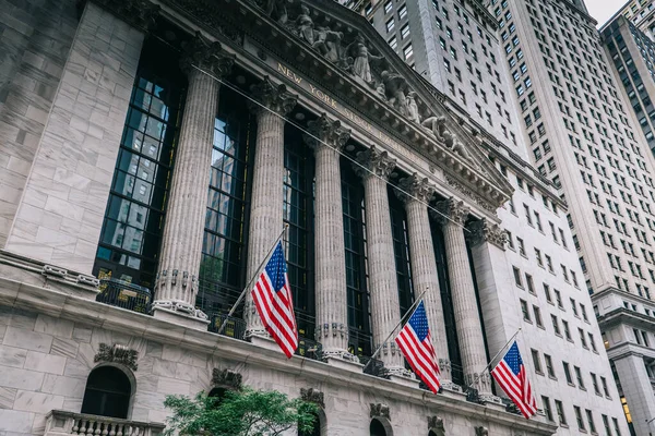 Front of the 1908 New York Stock Exchange on Broad Street with American flags on a front. High quality photo
