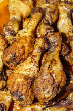 A close up of fried chicken legs, drumsticks, tasty and unhealthy food compilation. High quality photo
