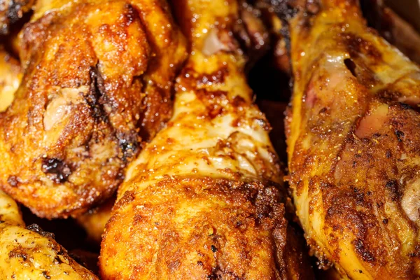 A close up of fried chicken legs, drumsticks, tasty and unhealthy food compilation. High quality photo