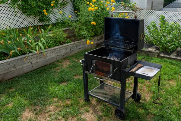 Scene Of Family Barbecue Grill Party Or Picnic On The Lawn In The Backyard At Summertime Weekend. High quality photo