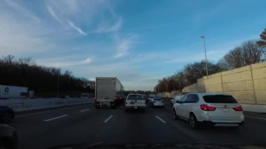 Nashville, Tennessee January 13, 2018: POV driving in evening rush hour traffic on Interstate 65 headed north out of Nashville, Tennessee at sunset
