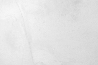 Beyaz taş dokusunun yüzeyi pürüzlü, gri-beyaz tonda. Duvar kağıdı veya arkaplan resmi için bunu kullanın. Metin için boş bir boşluk var.