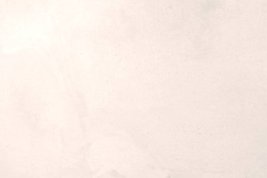 Beyaz ısınan taş dokusunun yüzeyinde kaba, gri-beyaz bir ton var. Duvar kağıdı veya arkaplan resmi için bunu kullanın. Metin için boş bir boşluk var.