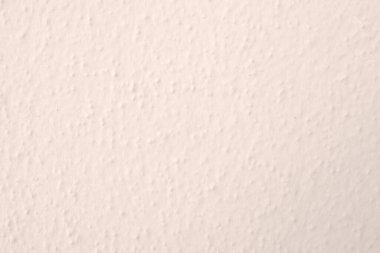 Seamless texture of white warming cement wall a rough surface, with space for text, for a background.	