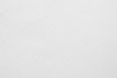 Beyaz beton duvarın pürüzsüz dokusu kaba bir yüzey, metin için boşluk, arkaplan için alan.