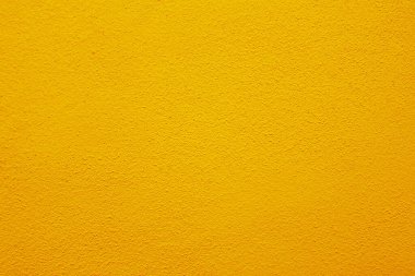 Seamless texture of orange cement wall a rough surface, with space for text, for a background.	