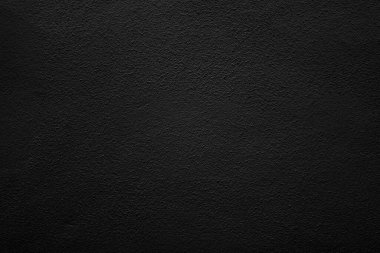 Seamless texture of black cement wall a rough surface, with space for text, for a background.	