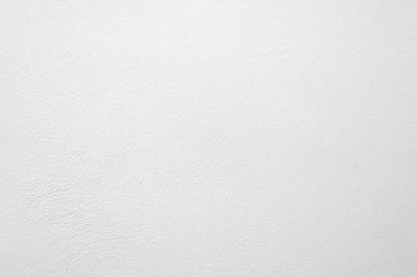 Beyaz beton duvarın pürüzsüz dokusu kaba bir yüzey, metin için boşluk, arkaplan için alan.