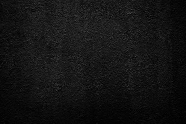 Siyah beton duvarın pürüzsüz dokusu kaba bir yüzey, metin ve arkaplan için alanı var..