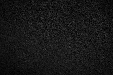 Seamless texture of black cement wall a rough surface, with space for text, for a background.	