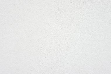 Beyaz beton duvarın pürüzsüz dokusu kaba bir yüzey, metin için boşluk, arkaplan için alan.