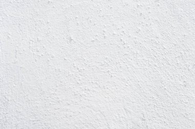 Beyaz beton duvarın pürüzsüz dokusu kaba bir yüzey, metin için boşluk, arkaplan için alan.