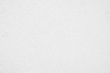 Beyaz beton duvarın pürüzsüz dokusu kaba bir yüzey, metin için boşluk, arkaplan için alan.