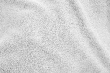 Beyaz, temiz yün dokusu arka planda. hafif doğal koyun yünü. Beyaz, pürüzsüz pamuk. Tasarımcılar için tüylü kürk dokusu. yakın plan beyaz yün halı..