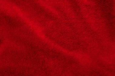 Kırmızı temiz yün dokusu arka planda. hafif doğal koyun yünü. Kırmızı, pürüzsüz pamuk. Tasarımcılar için tüylü kürk dokusu. yakın plan kırmızı yün halı..