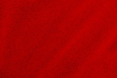 Kırmızı temiz yün dokusu arka planda. hafif doğal koyun yünü. Kırmızı, pürüzsüz pamuk. Tasarımcılar için tüylü kürk dokusu Noel günü. yakın plan kırmızı yün halı..
