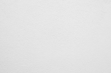 Beyaz beton duvarın pürüzsüz dokusu kaba bir yüzey, metin için boşluk, arkaplan için alan.