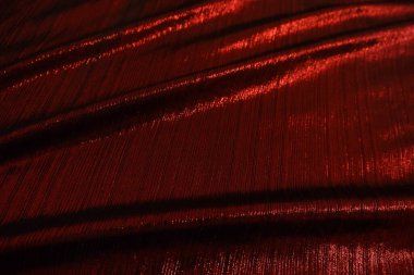 Red reflect velvet fabric texture used as background. Empty red fabric background of soft and smooth textile material. There is space for text.	