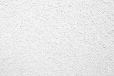 Beyaz beton duvarın pürüzsüz dokusu kaba bir yüzey, metin için boşluk, arkaplan için alan.