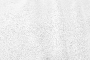 White clean wool texture background. light natural sheep wool. white seamless cotton. texture of fluffy fur for designers. close-up fragment white wool carpet.	