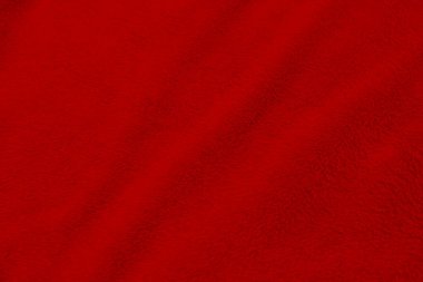 Kırmızı temiz yün dokusu arka planda. hafif doğal koyun yünü. Kırmızı, pürüzsüz pamuk. Tasarımcılar için tüylü kürk dokusu Noel günü. yakın plan kırmızı yün halı...