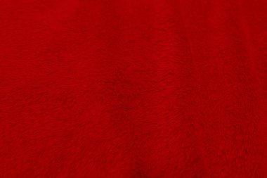 Kırmızı temiz yün dokusu arka planda. hafif doğal koyun yünü. Kırmızı, pürüzsüz pamuk. Tasarımcılar için tüylü kürk dokusu Noel günü. yakın plan kırmızı yün halı...