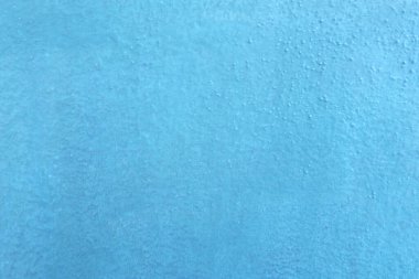 Seamless texture of blue cement wall a rough surface, with space for text, for a background.	