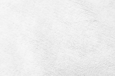 Beyaz, temiz yün dokusu arka planda. hafif doğal koyun yünü. Beyaz, pürüzsüz pamuk. Tasarımcılar için tüylü kürk dokusu. yakın plan beyaz yün halı.