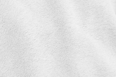 White clean wool texture background. light natural sheep wool. white seamless cotton. texture of fluffy fur for designers. close-up fragment white wool carpet.	