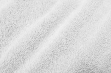 White clean wool texture background. light natural sheep wool. white seamless cotton. texture of fluffy fur for designers. close-up fragment white wool carpet.	