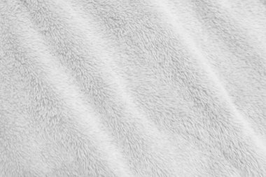 White clean wool texture background. light natural sheep wool. white seamless cotton. texture of fluffy fur for designers. close-up fragment white wool carpet.	