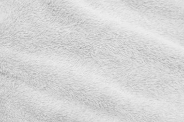 White clean wool texture background. light natural sheep wool. white seamless cotton. texture of fluffy fur for designers. close-up fragment white wool carpet.	