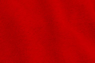 Red clean wool texture background. light natural sheep wool. red seamless cotton. texture of fluffy fur for designers. close-up fragment red wool carpet.	