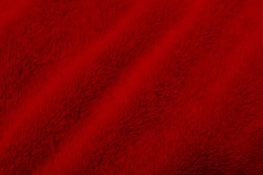 Red clean wool texture background. light natural sheep wool. red seamless cotton. texture of fluffy fur for designers. close-up fragment red wool carpet.	