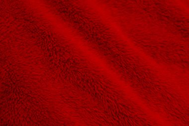 Red clean wool texture background. light natural sheep wool. red seamless cotton. texture of fluffy fur for designers. close-up fragment red wool carpet.	