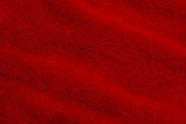 Red clean wool texture background. light natural sheep wool. red seamless cotton. texture of fluffy fur for designers. close-up fragment red wool carpet.	