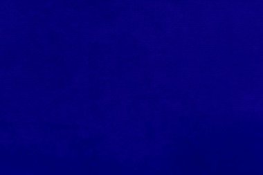 The texture of the old blue fabric has a vintage dullness, there is a text area for the background, used for vintage wallpapers and designs.	